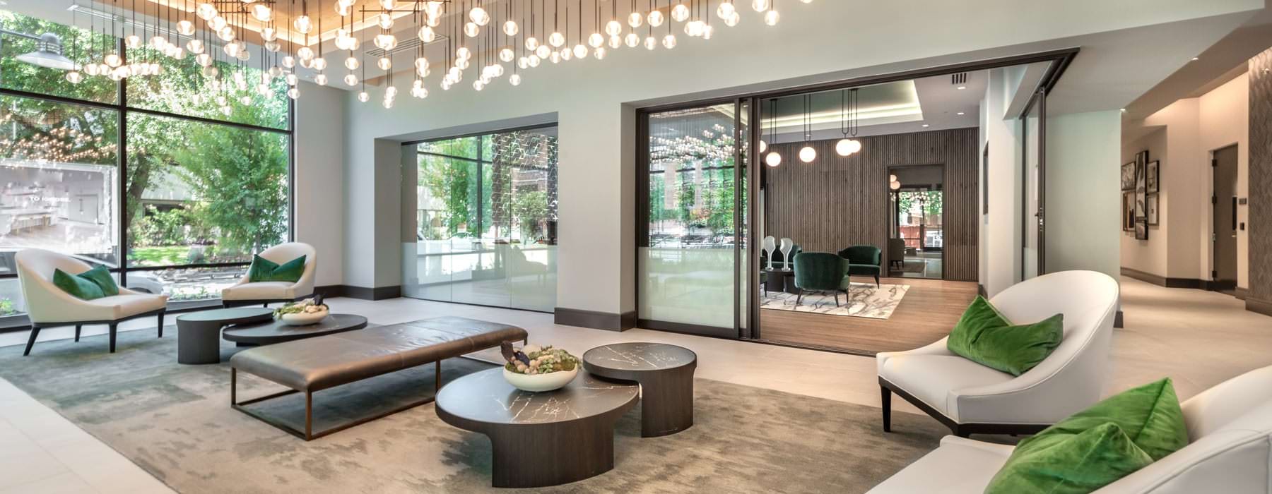 beautiful lighting grid hangs above lounge area in resident center