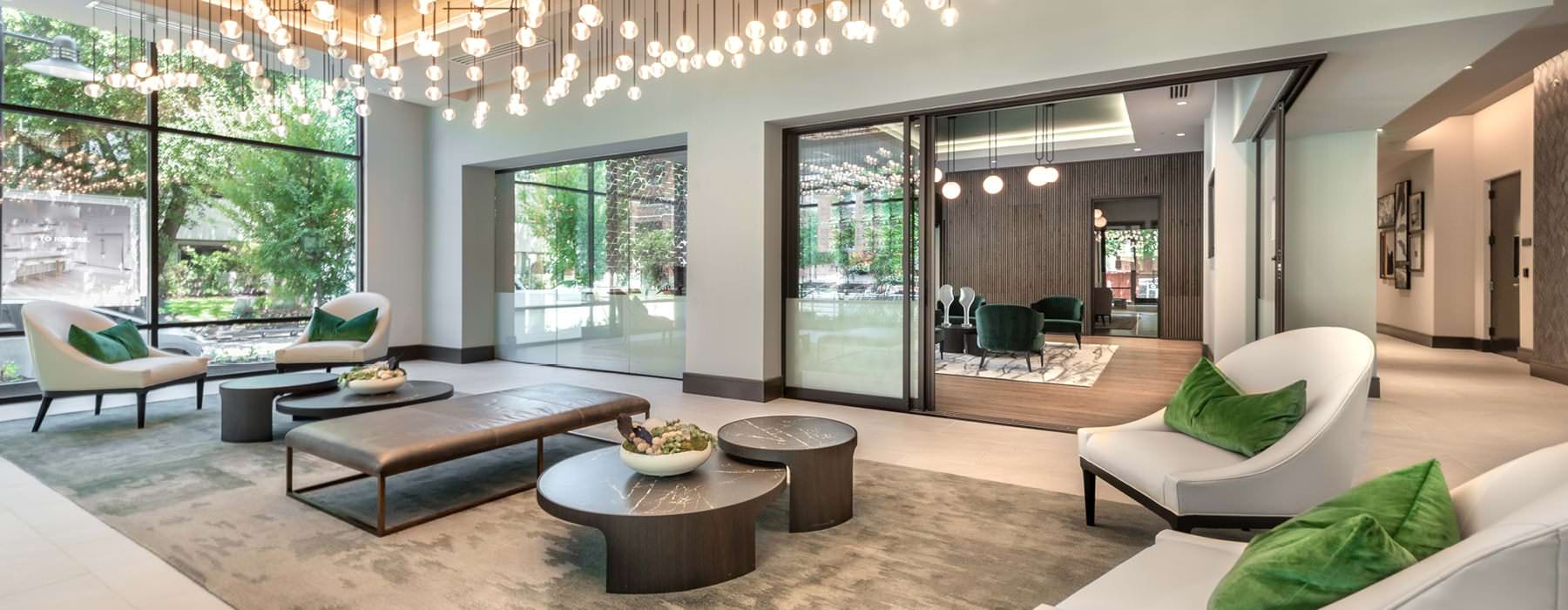 beautiful lighting grid hangs above lounge area in resident center